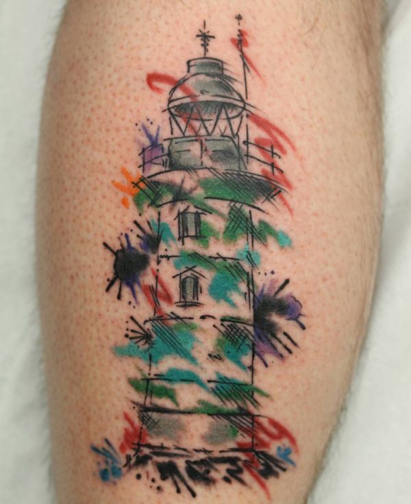 Tatuagem de farol aquarela na parte inferior da perna 