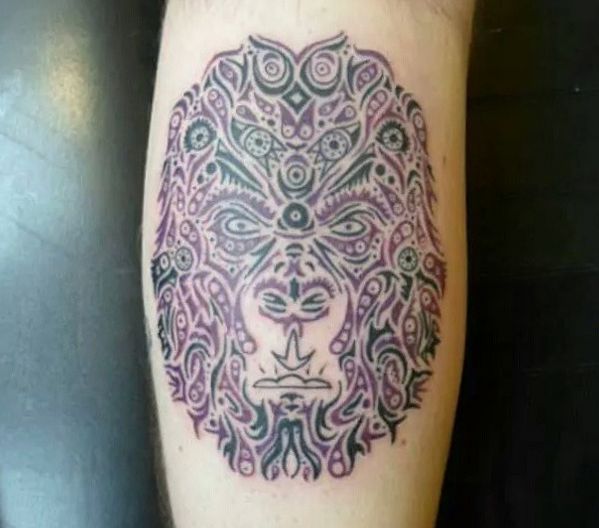 Desenho de tatuagem de macaco de mandala na parte inferior da perna 