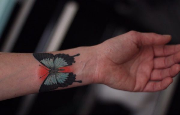 Tatuagem de borboleta Ulysses no pulso 